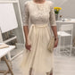 Elegantes Midikleid aus Netzstoff mit Spitzenkragen