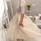 Elegantes Midikleid aus Netzstoff mit Spitzenkragen